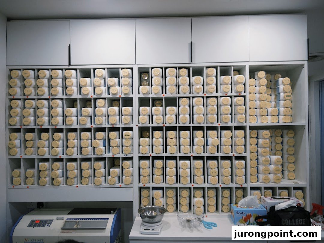 Interior view of Yong Kang TCM Clinic, featuring shelves stocked with numerous traditional herbal medicine containers.