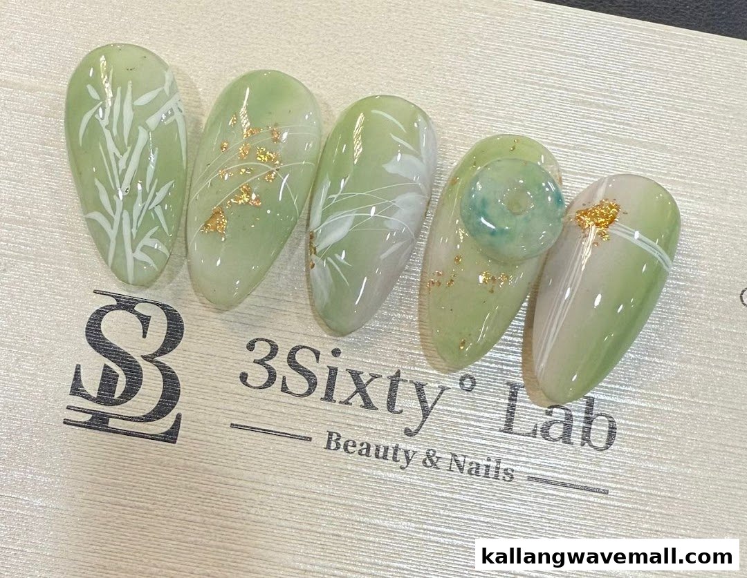 Five elegant green-themed nail art samples featuring intricate designs, gold flakes, and a jade-like embellishment.