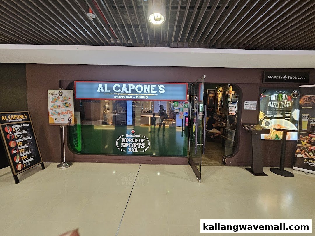 The inviting entrance of Al Capone's Sports Bar + Dining, featuring promotional signs and a clear view inside.