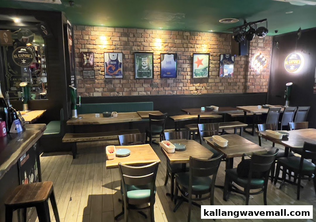 An inviting interior view of Al Capones, featuring brick walls, wooden tables, and comfortable seating.