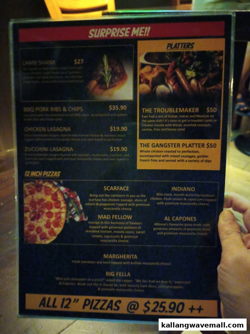 A detailed menu from Al Capones, showcasing a variety of main dishes, platters, and 12-inch pizzas.
