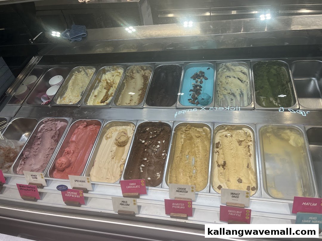 A vibrant display case showcasing a variety of delicious ice cream and gelato flavors.