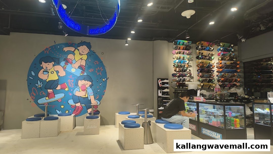 Interior of a vibrant shop featuring skateboards, a colorful mural, casual seating, and a customer.