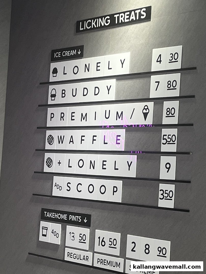 A clear menu board displaying ice cream and take-home pint options with prices.