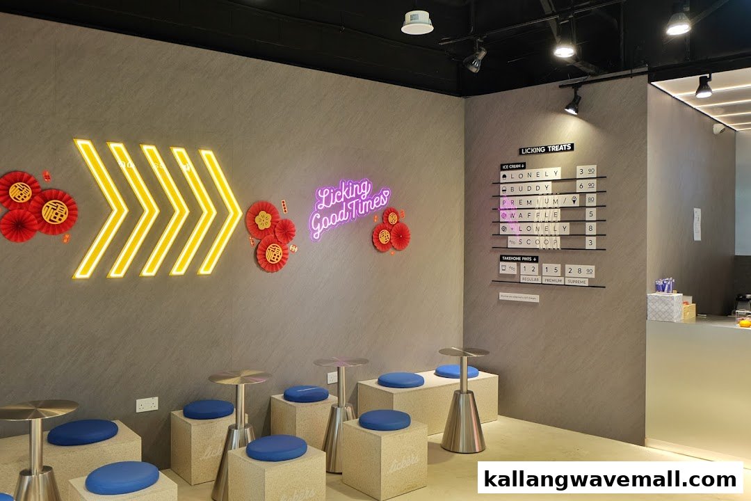 Modern ice cream shop interior with neon signs, comfortable seating, and a clear menu board.