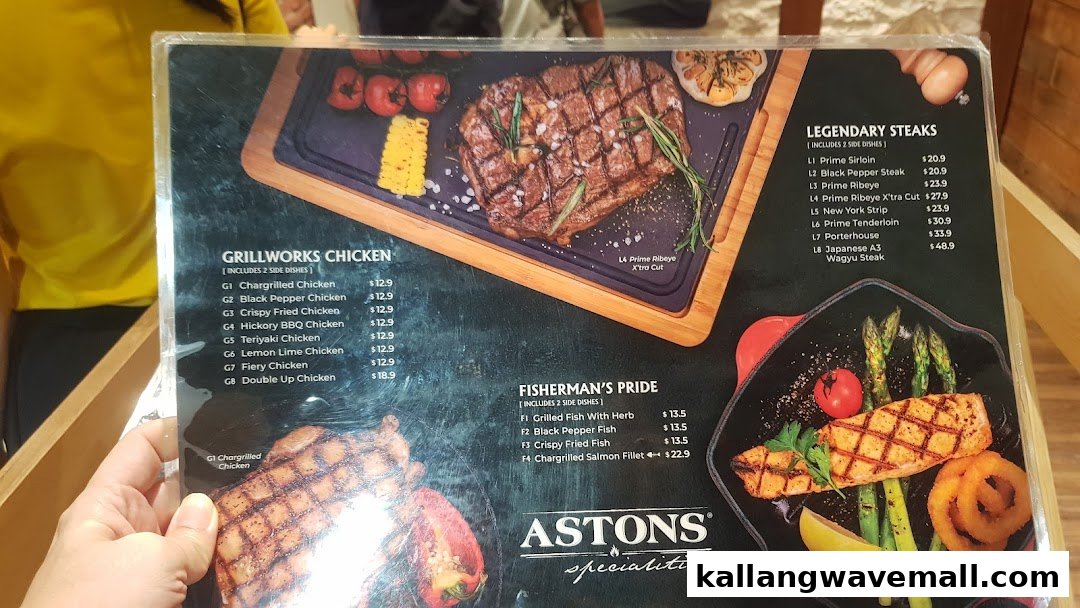 A close-up view of ASTONS Specialities' menu, showcasing steaks, chicken, and fish dishes.