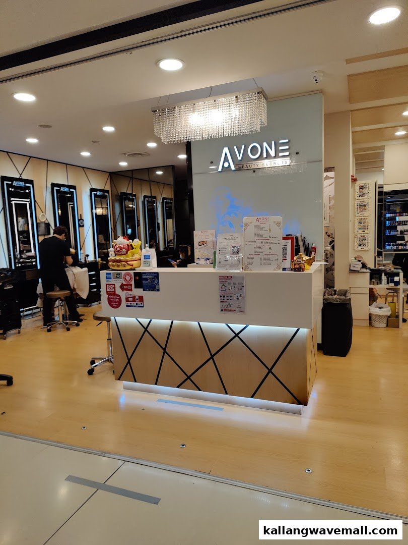 Interior view of Avone Beauty Secrets, featuring the reception desk and salon area with stylists at work.