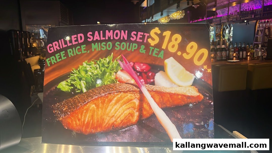 A promotional sign displaying a Grilled Salmon Set with rice, miso soup, and tea for $18.90.