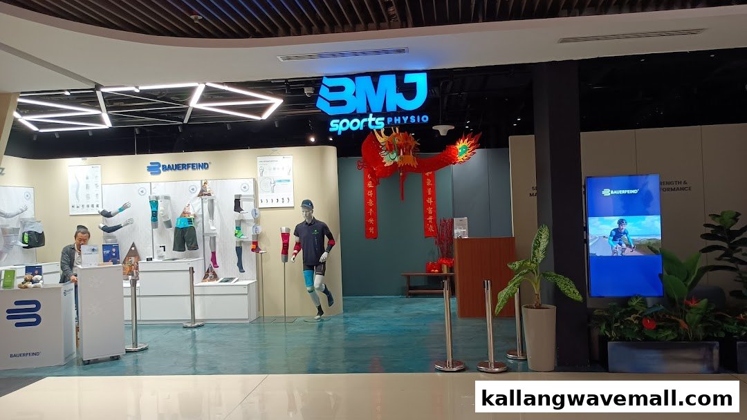 The storefront of BMJ Sports Physio, featuring product displays and a reception area.