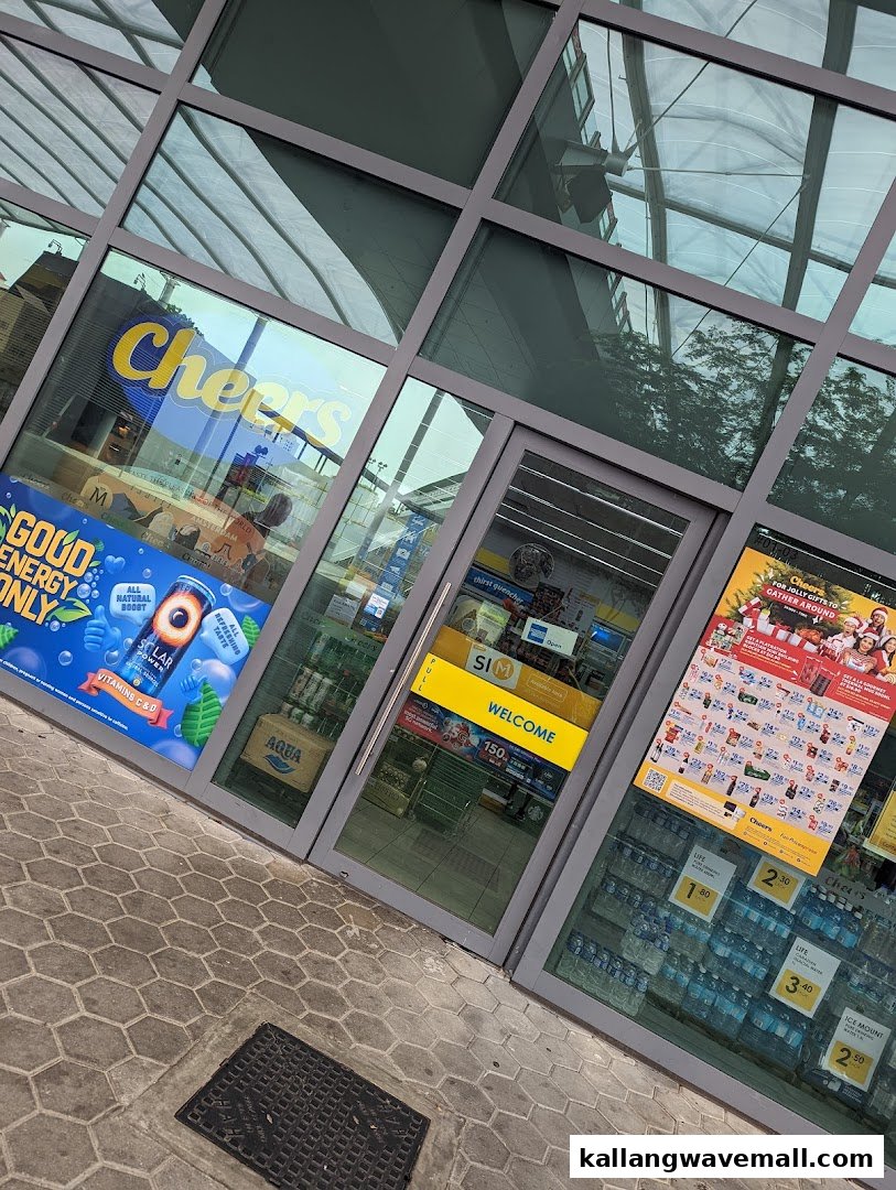 The glass entrance of a Cheers convenience store, showcasing various promotions and products inside.