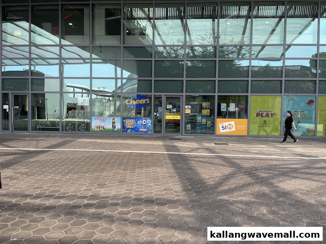 Exterior view of Cheers Sports Hub, a convenience store with a glass facade, and a person walking past.