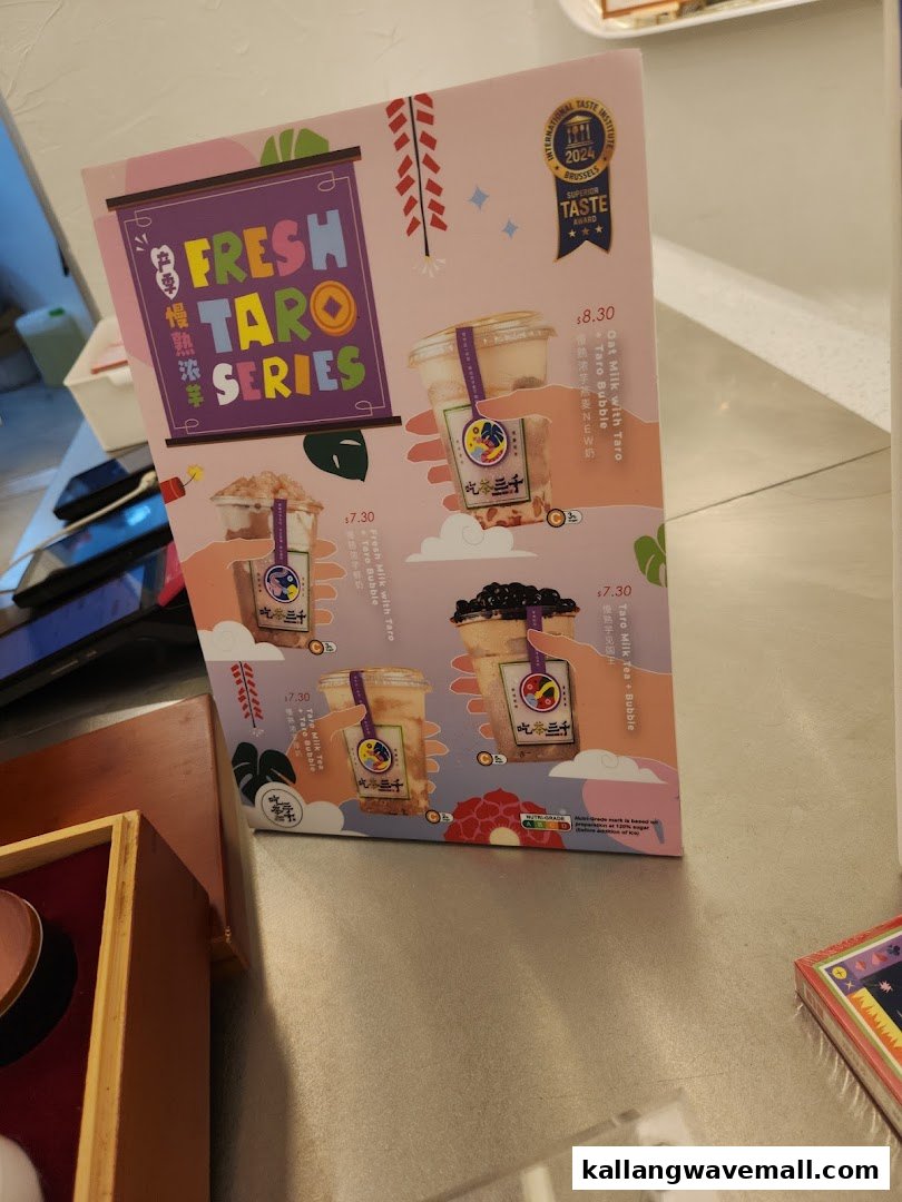 A vibrant menu board showcasing CHICHA San Chen's Fresh Taro Series bubble tea drinks.