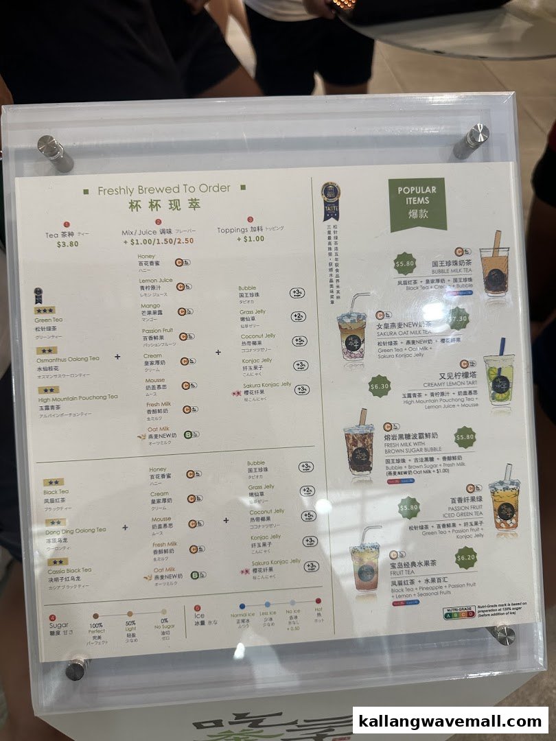 A detailed menu board showcasing bubble tea, fruit tea, and customization options with prices.