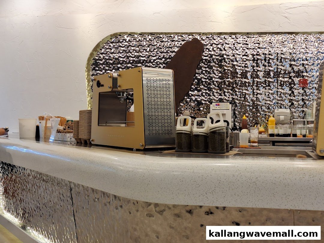 A modern bubble tea counter showcasing brewing equipment and ingredients at CHICHA San Chen.