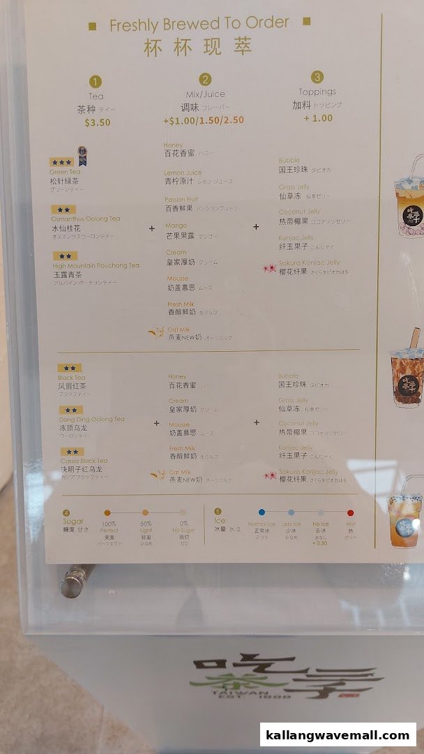 A detailed menu board displaying tea, mix/juice, and topping options with prices.