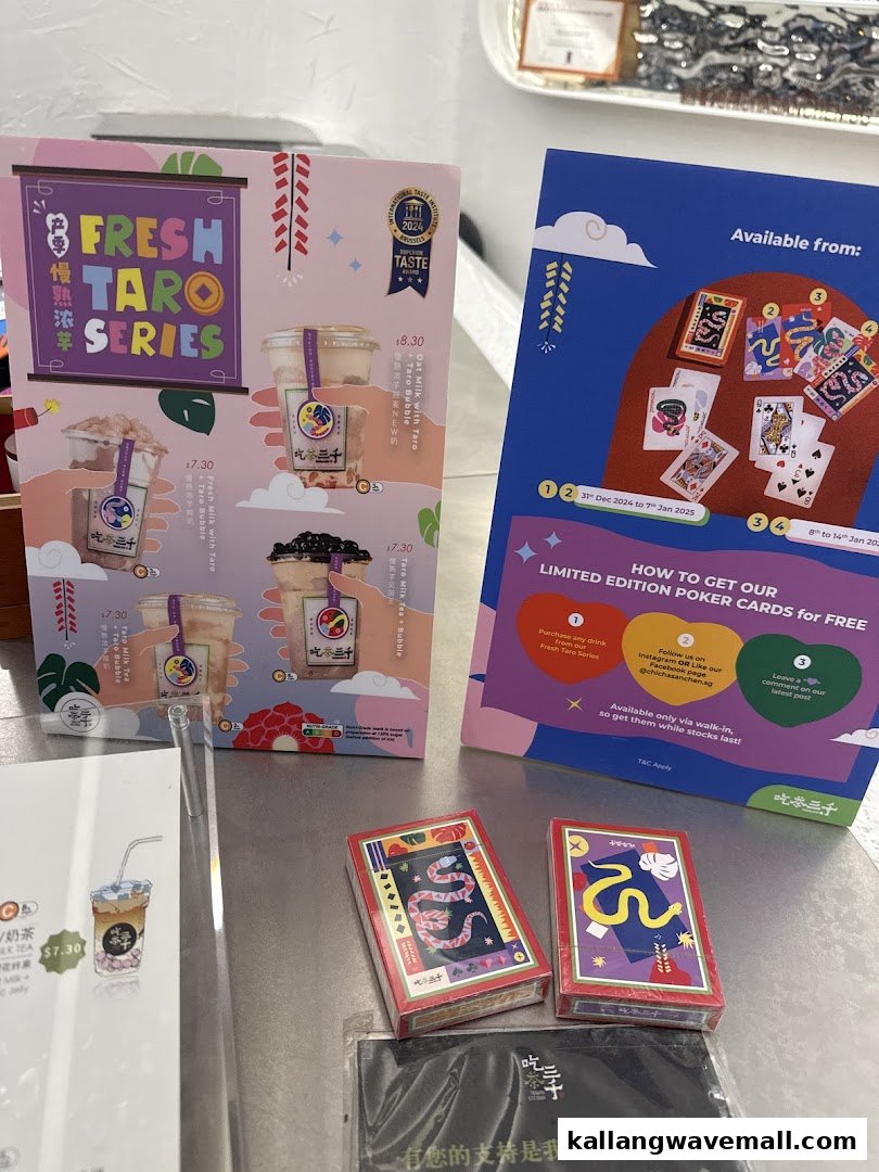 A vibrant display showcasing CHICHA San Chen's Fresh Taro Series drinks and a limited edition poker card promotion.