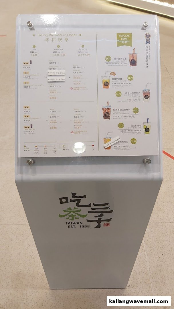 A detailed menu board displaying various bubble tea and beverage options with prices.