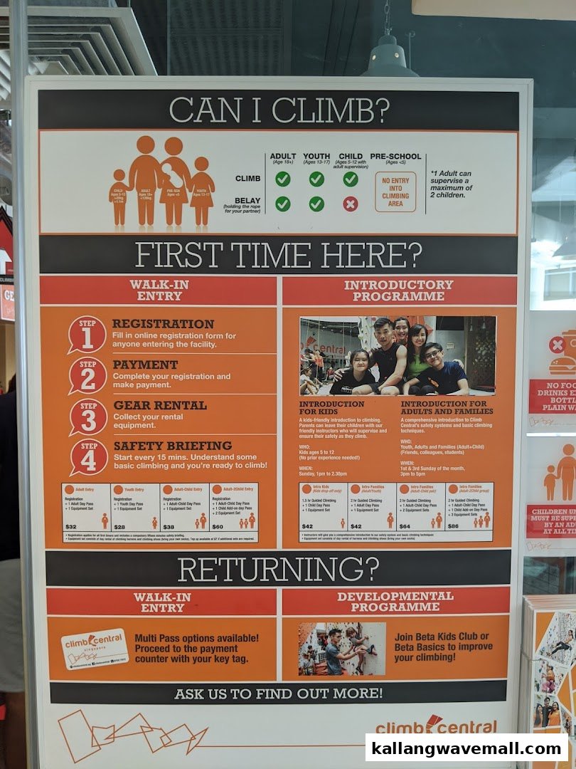 An informational board at Climb Central Sports Hub detailing entry requirements, programs, and pricing.