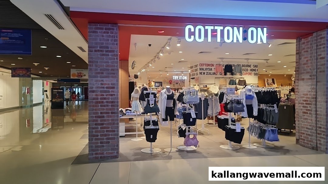 The brightly lit entrance of Cotton On Sports Hub, showcasing activewear and casual apparel displays.