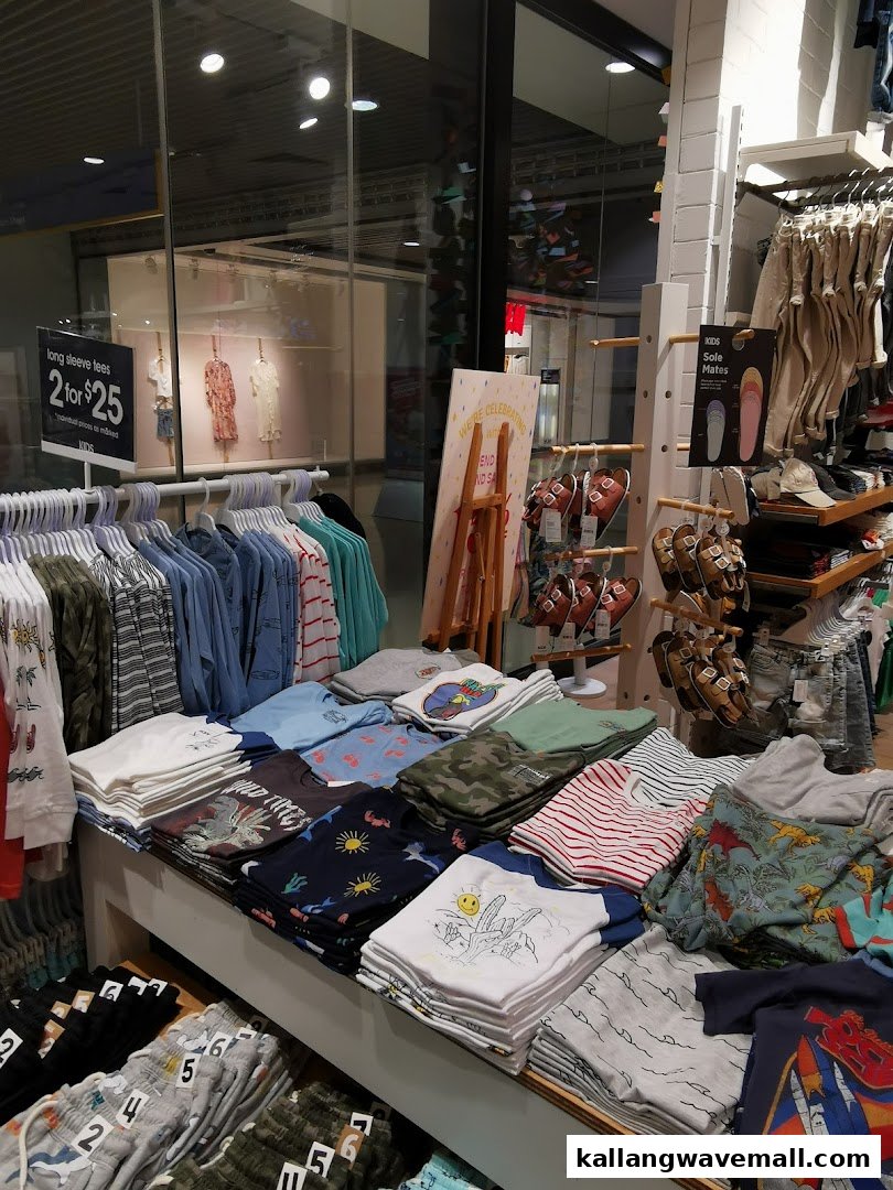 An interior view of Cotton On Sports Hub, showcasing a vibrant display of kids' apparel and accessories.