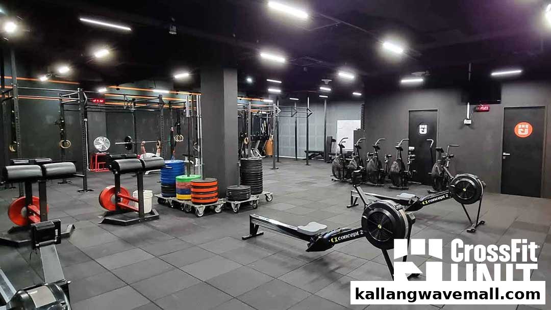 An interior view of CrossFit Unit, showcasing various fitness equipment and a spacious workout area.