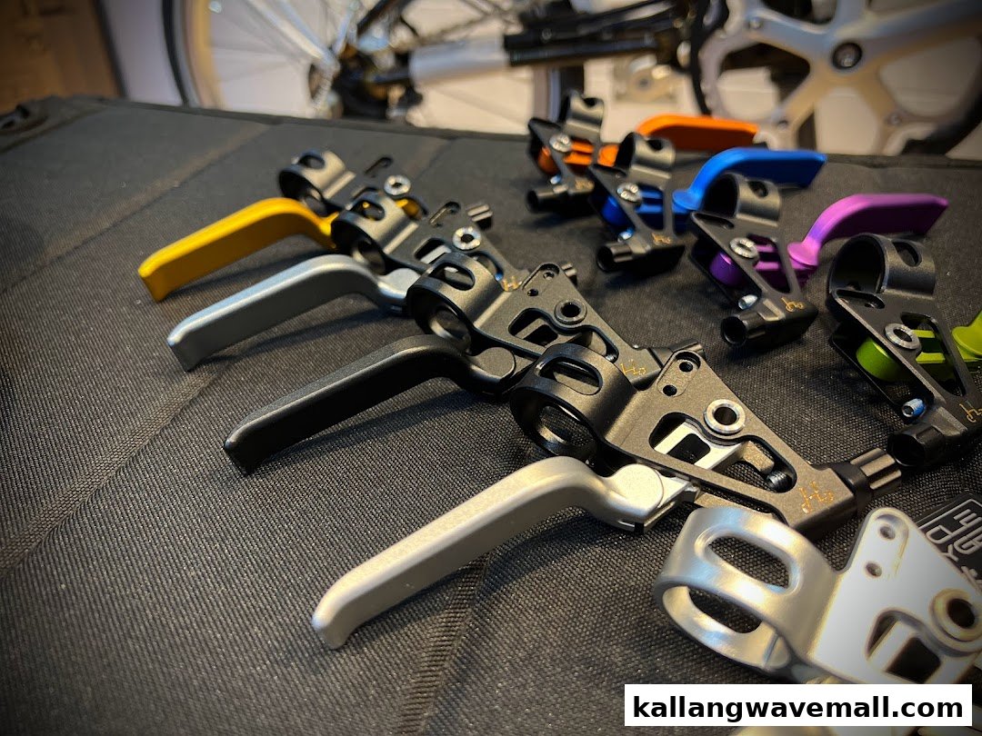 A close-up of colorful bicycle brake levers and shifters, showcasing various options for bike enthusiasts.