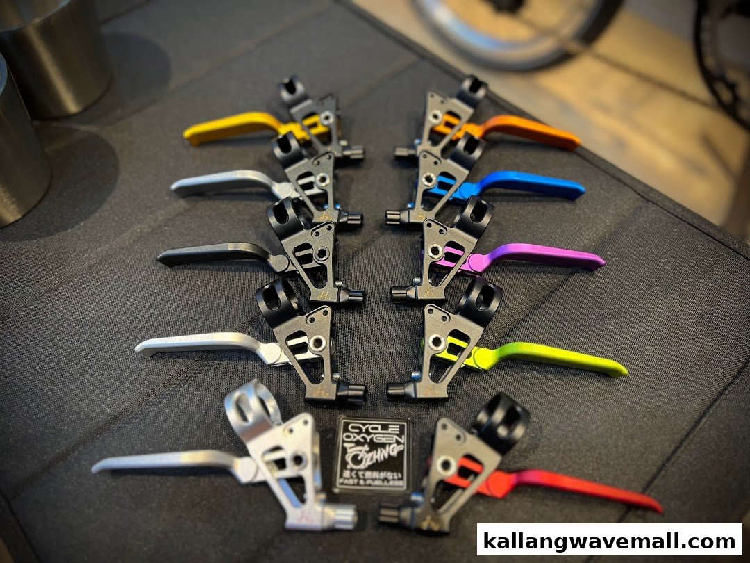 Colorful bicycle brake levers displayed, showcasing various options from CycleOxygen.