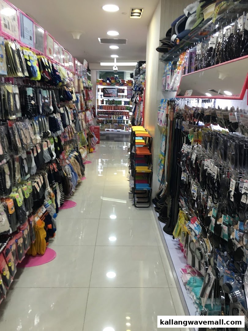 A brightly lit interior aisle of Daiso, showcasing various everyday products on shelves.
