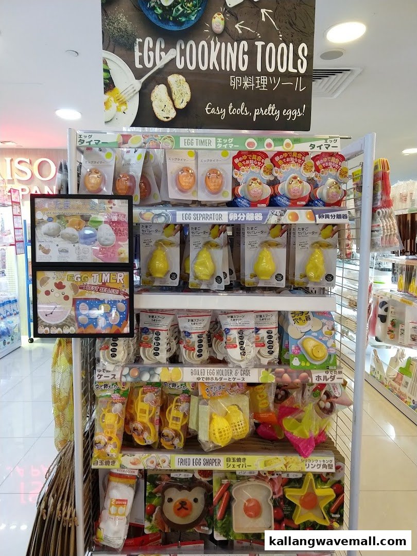 A retail display showcasing various egg cooking tools and kitchen gadgets.