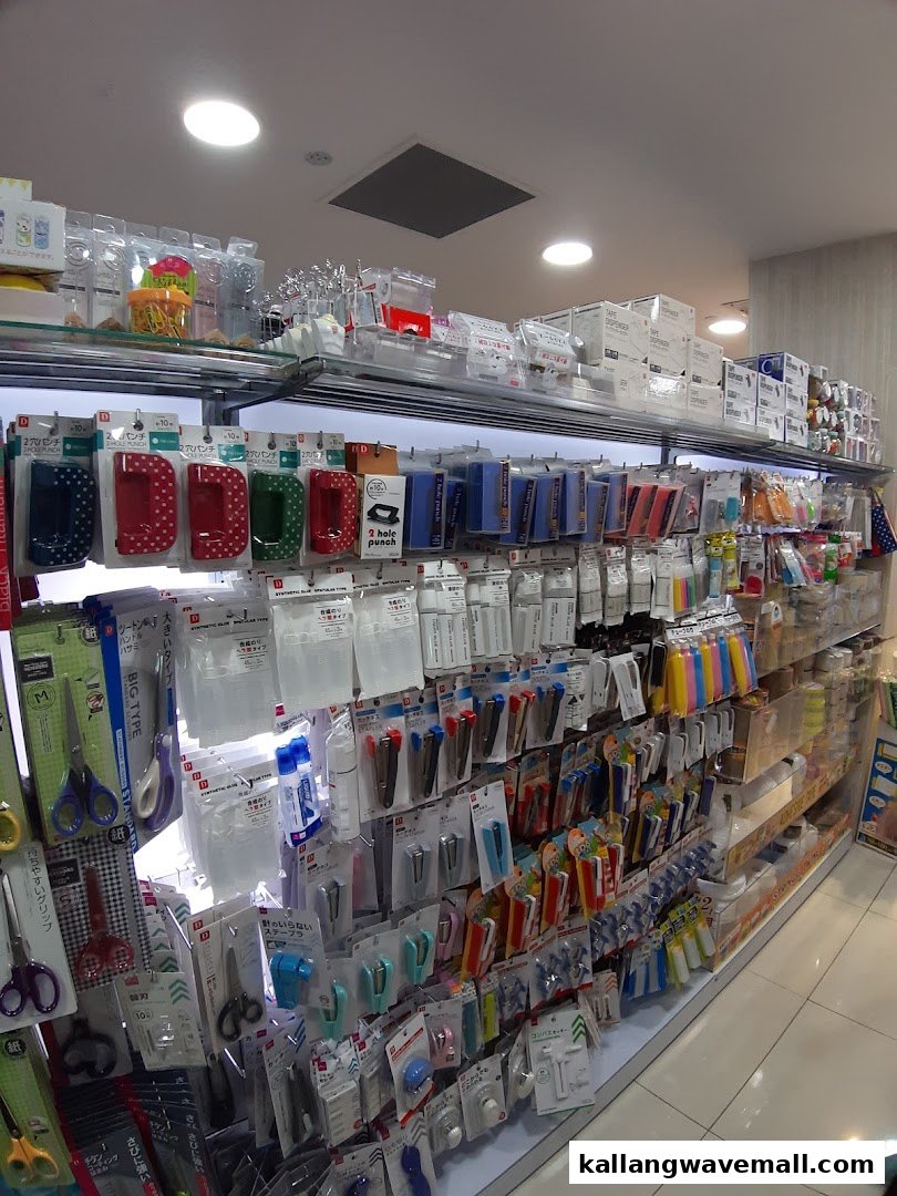 An aisle inside Daiso showcasing a wide array of stationery and household goods.