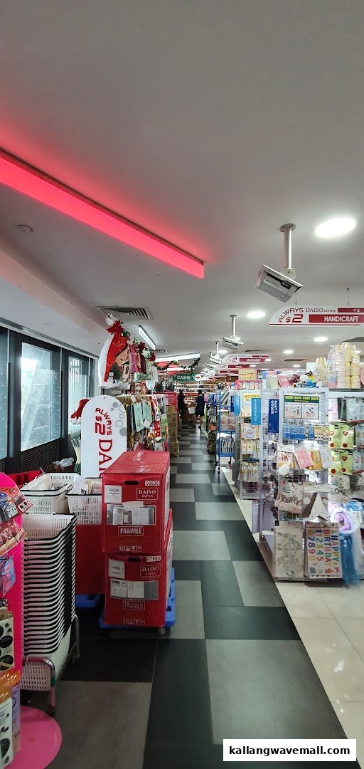 An interior view of Daiso, showcasing aisles filled with various products and shopping baskets.