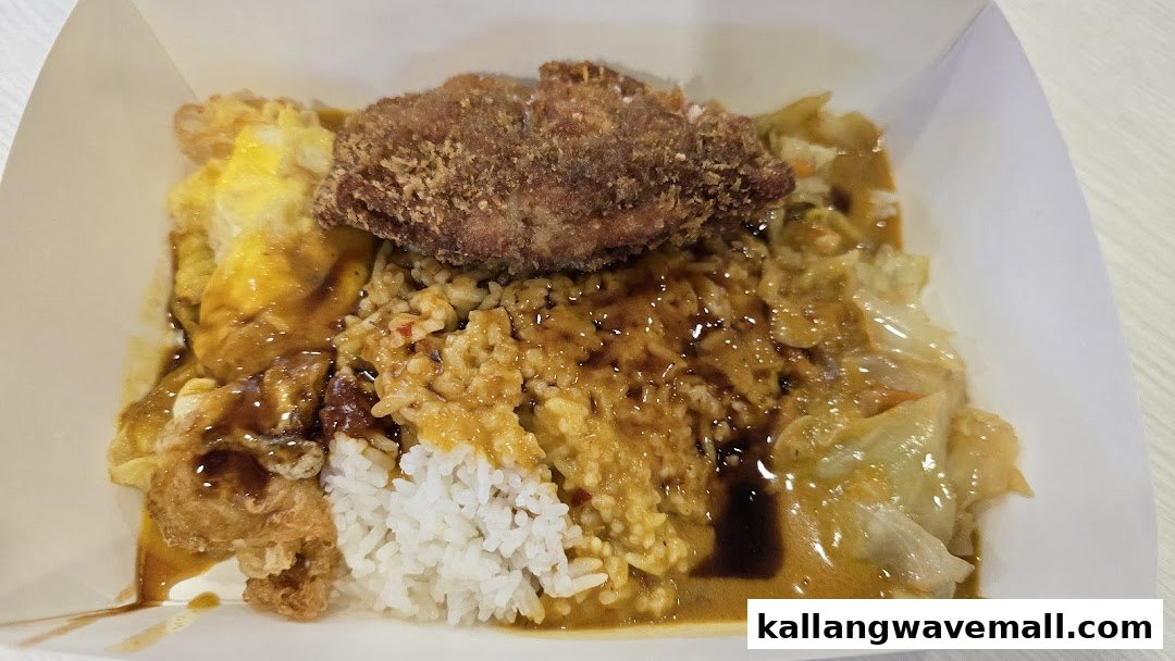 A hearty meal with rice, fried cutlet, egg, and vegetables in a takeaway box.