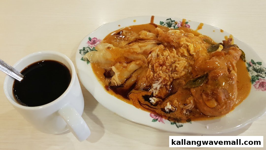A plate of curry chicken with rice and flatbread, served with a cup of black coffee.