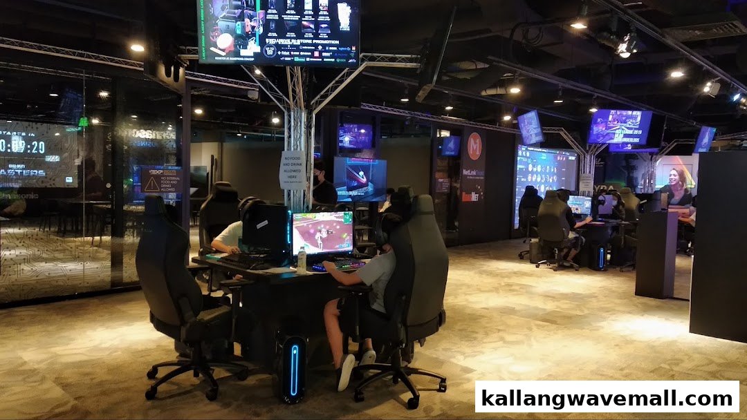 Gamers play on high-end PCs in a modern esports experience center with multiple stations.