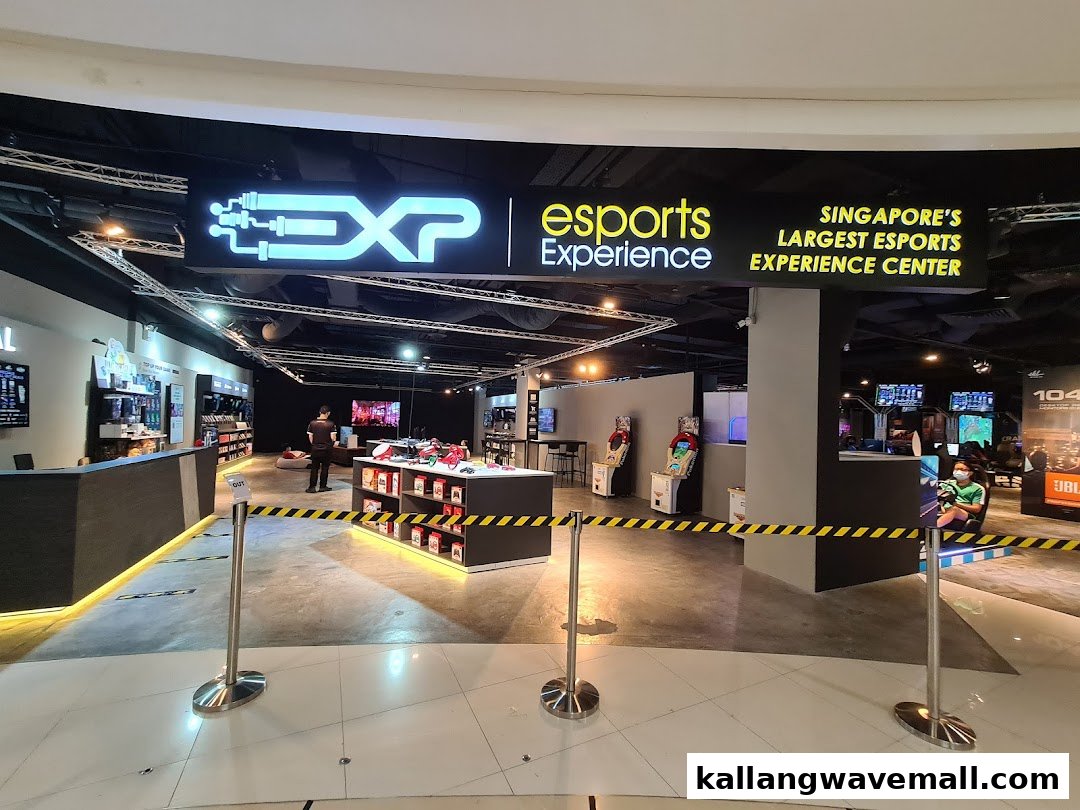 The entrance to Singapore's largest Esports Experience Center, featuring gaming setups and merchandise displays.