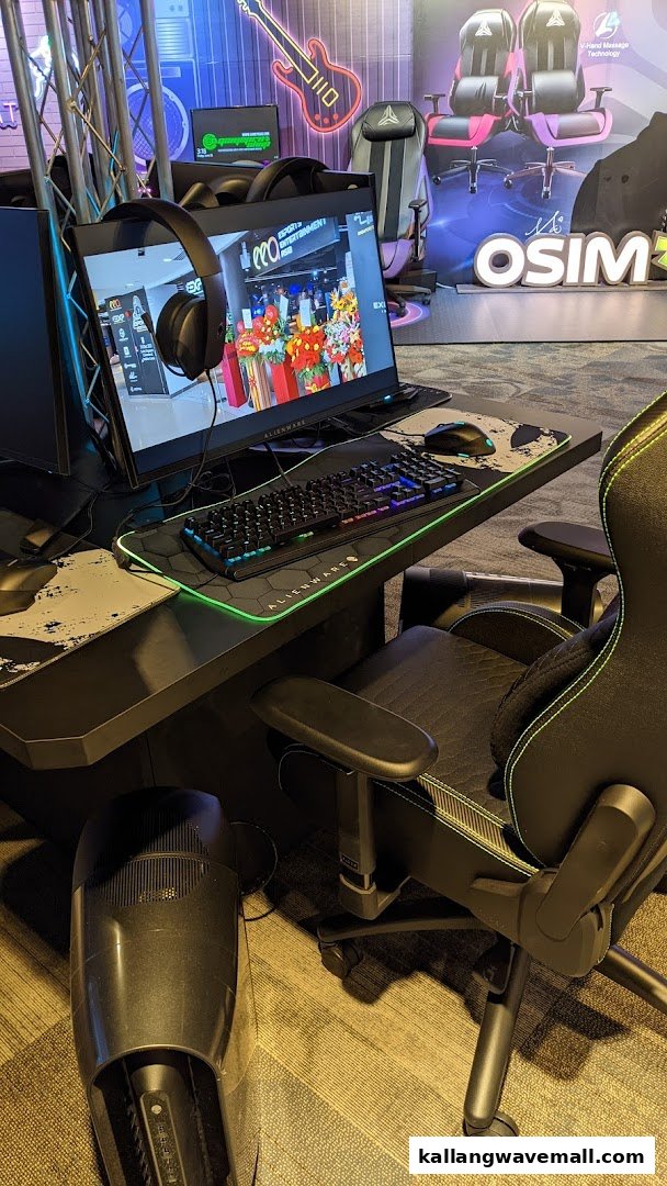 A high-performance Alienware gaming setup with a monitor, keyboard, mouse, and ergonomic gaming chair, ready for esports action.