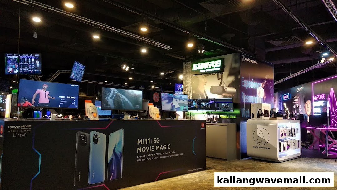 An immersive esports experience center featuring gaming setups, mobile tech displays, and premium audio equipment.