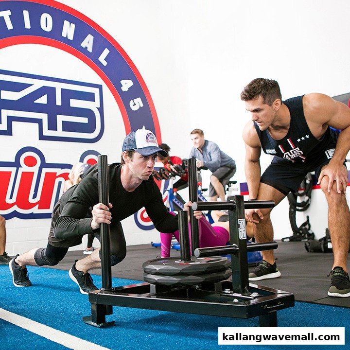 Members engage in functional training with sleds and other equipment at F45 Training.