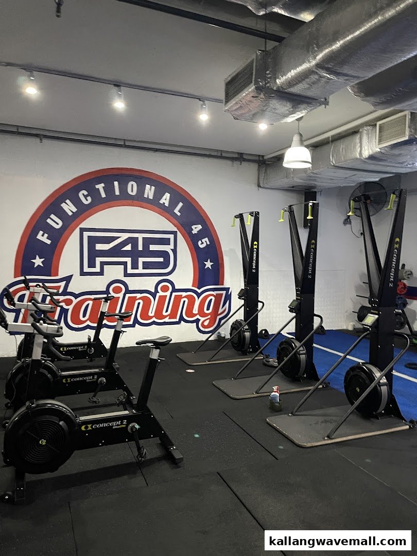 Interior view of F45 Training gym with exercise bikes and ski erg machines.