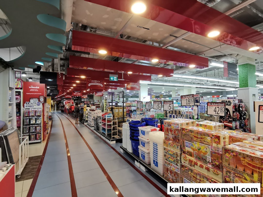 A wide, well-lit aisle inside FairPrice Xtra, showcasing diverse products and special offers.