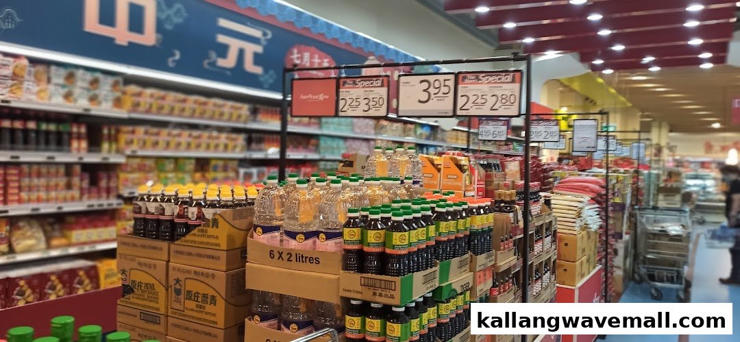 A supermarket aisle displaying various bottled products, including cooking oil and sauces, with special offer signs.