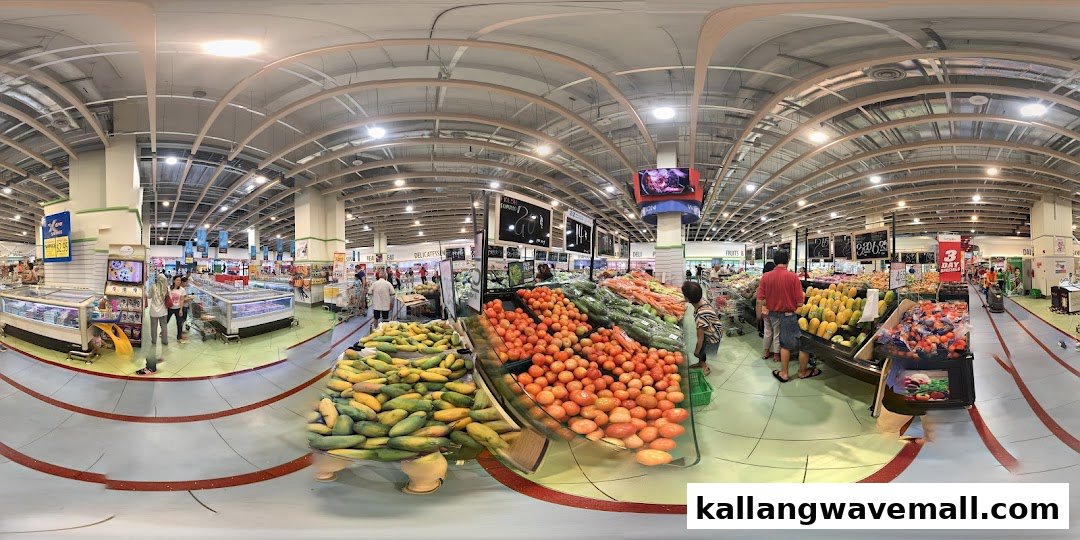 A wide-angle view of FairPrice Xtra Sports Hub supermarket interior, showcasing fresh produce aisles and shoppers.