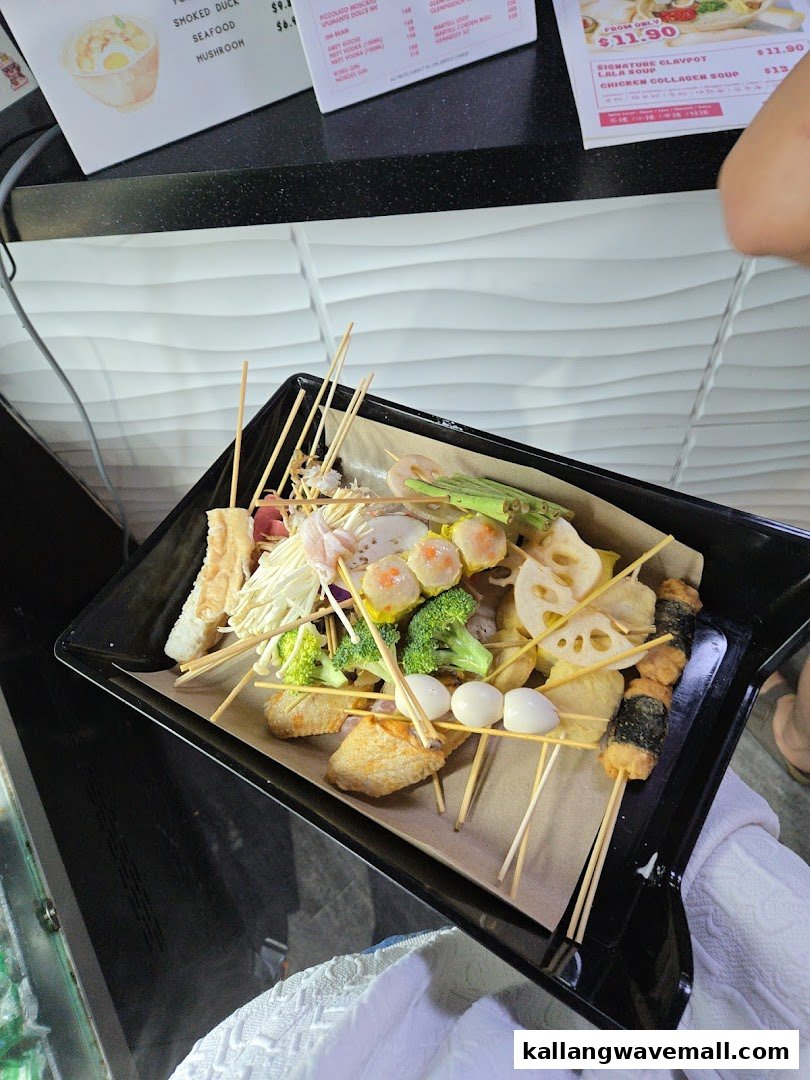 A vibrant tray of assorted skewered ingredients, including vegetables and proteins, ready for hotpot.