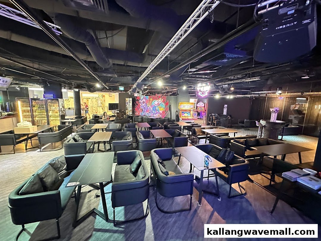 Spacious interior of Fei Zhu Lok Lok restaurant, featuring modern seating, arcade games, and a vibrant, casual atmosphere.