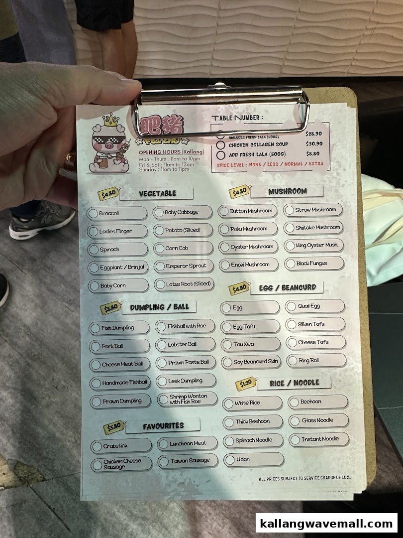 A close-up of a hotpot restaurant's menu, showing various ingredients and prices.