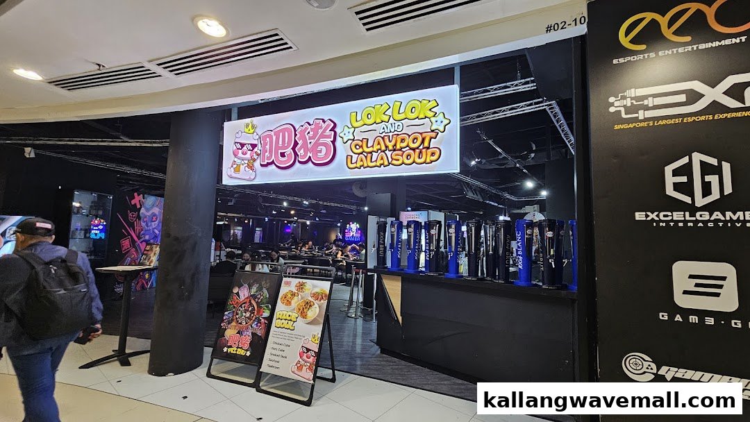 The vibrant entrance of Fei Zhu Lok Lok Claypot Lala Hotpot Restaurant, showcasing its sign and dining area.