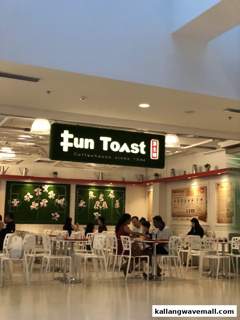 Customers enjoy traditional coffee and toast in the vibrant interior of Fun Toast Coffeehouse.