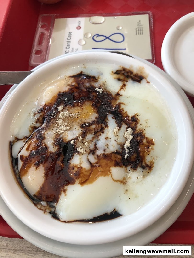 A close-up of traditional soft-boiled eggs with dark soy sauce and white pepper.