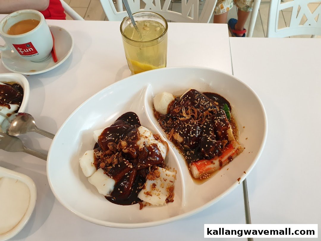 A delicious plate of chee cheong fun with sauce and toppings, accompanied by coffee and a drink at Fun Toast.