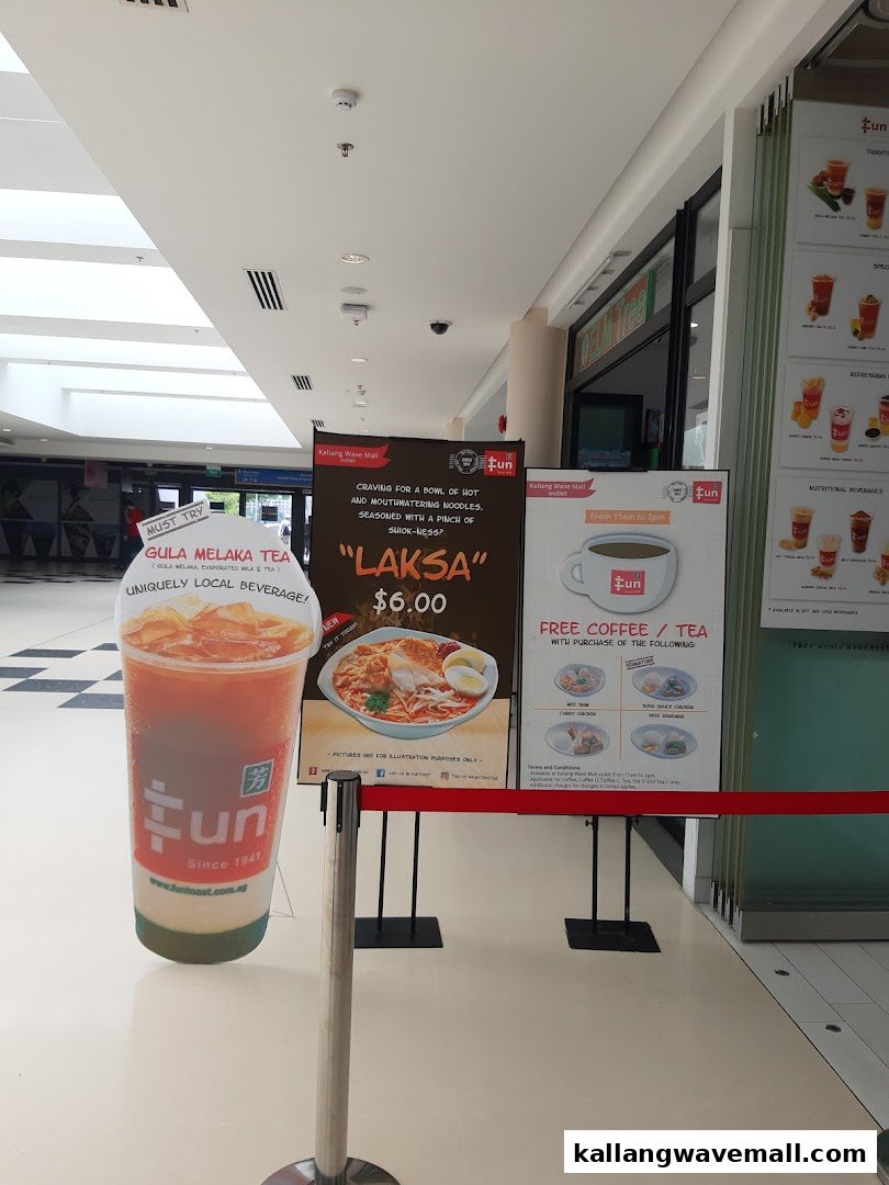 Promotional standees for Fun Toast featuring local beverages, Laksa, and a coffee/tea offer.